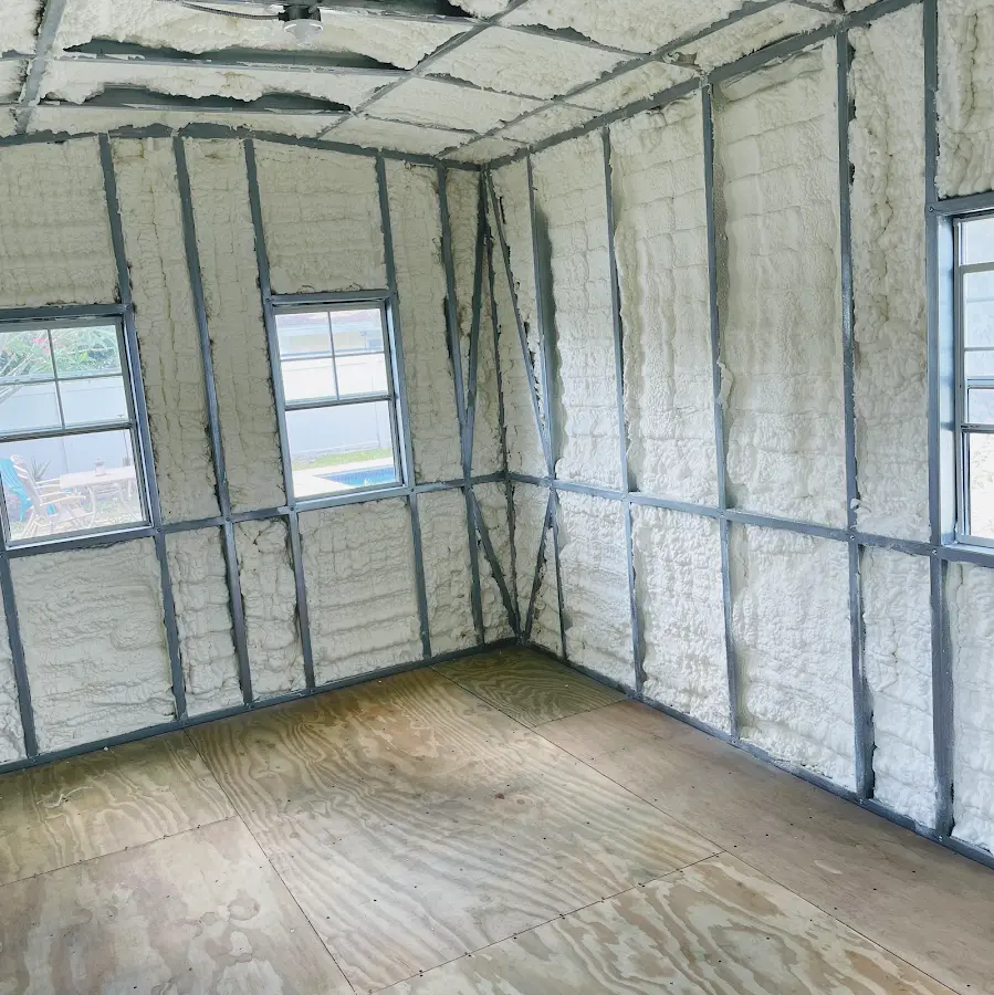 Closed-cell spray foam insulation applied to wall cavities in a residential project in West Little River